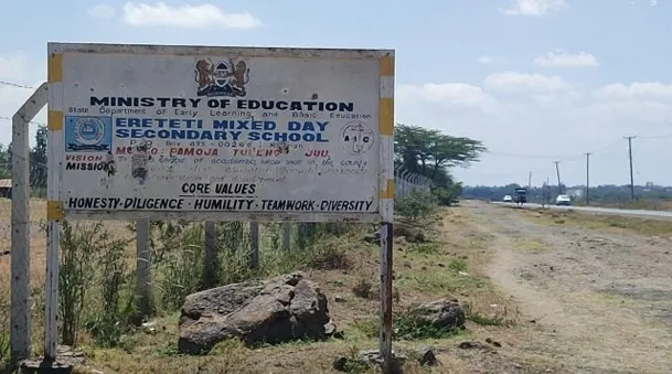 The Ereteti Mixed Day Secondary School sign at the school gate.